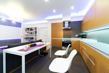 interior of modern kitchen with table and chairs