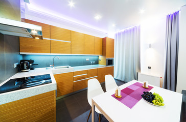 interior of modern kitchen with table and chairs