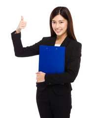 Business woman with clipboard and thumb up