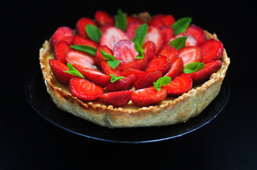 Strawberry tart with mint, selective focus