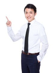 Businessman finger point up