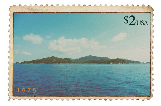 Vintage stylized postage stamp with tropical island on horizon