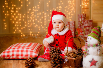 beautiful little girl in a New Year's suit. Red concept shooting