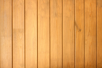 Fence from wooden vertical planks as background closeup
