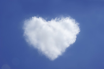 Naklejka na ściany i meble Heart shape cloud on blue sky