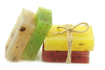 Colorful natural herbal soaps isolated on white background.