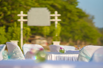 Luxury beach restaurant with tables and chairs covered with whit