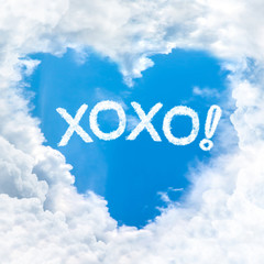 Fototapeta premium xoxo or kiss and hug word on blue sky