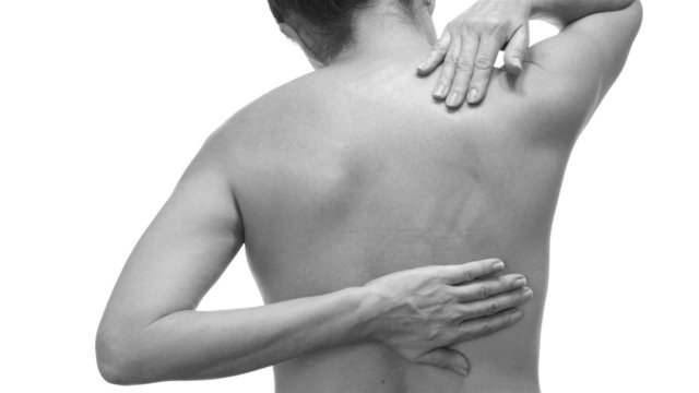 Female With Back Pain Black and White