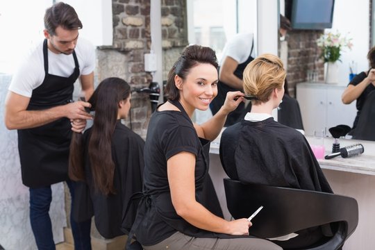 Hairdressers working on their clients