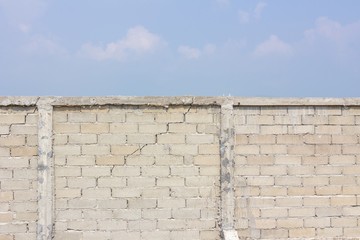 cracked wall in the background of cloud and sky