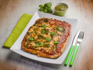 homemade pizza with pesto sauce