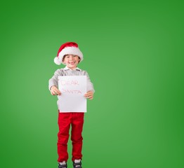 Composite image of festive boy showing letter