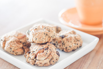 Closeup healthy cookies on white plate with coffee cup