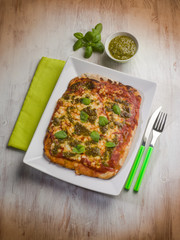 homemade pizza with pesto sauce