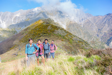 Fototapeta premium Happy Hikers at Top of Mountain
