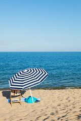 beach umbrella in front of the blue sea