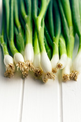 spring onion on white table