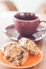 Closeup cereal cookies on orange plate