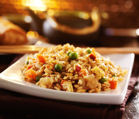chinese fried rice on plate with orange glow