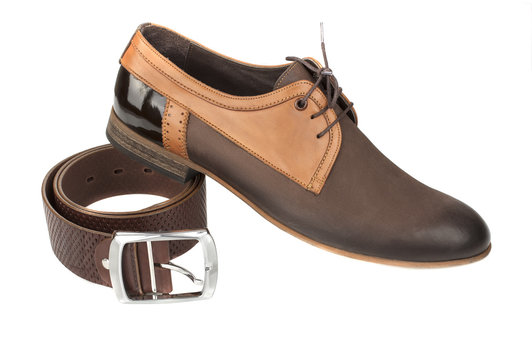 isolated stylish leather men's dress shoes and belt