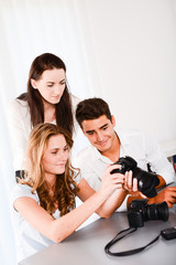 young student with teacher during photography editing course