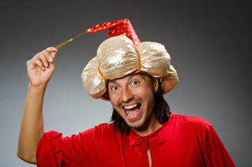 Funny wizard wearing red dress