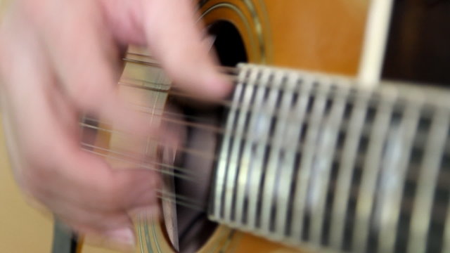 Musical instrument with guitarist hands
