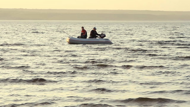 Two mans fishing together in a boat