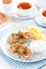 bread with salted salmon, cream cheese for breakfast, vertical