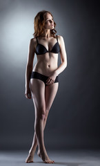 Fototapeta na wymiar Comely young model posing in lingerie
