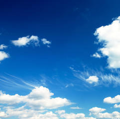white fluffy clouds in the blue sky