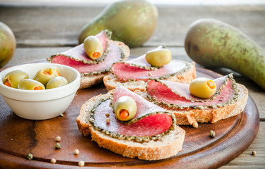 Slices of italian salami with pears