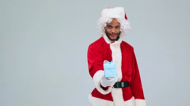 Santa Claus giving a gift in the box for you