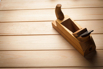 old wooden plane in a workshop of the carpenter