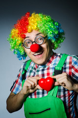 Clown with red heart in romantic concept