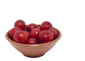 Ripe plums in bowl