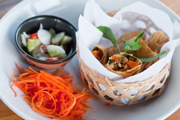 crispy spring rolls on dish with vegetable