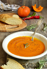 Pumpkin creamy soup with rosemary.