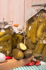 pickled gherkins in glass jars