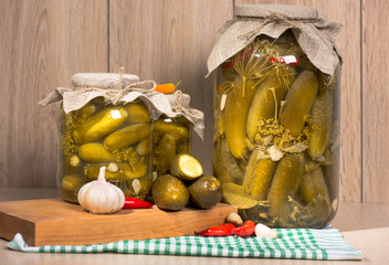 pickled gherkins in glass jars