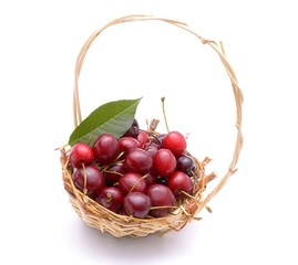 Cherry in basket isolated on white background