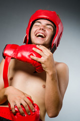 Funny boxer against dark background