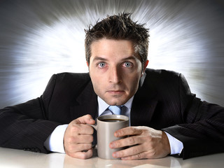 addict businessman holding coffee cup in caffeine addiction