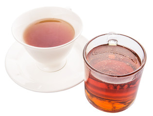 A cup of tea and a jar of honey over white background