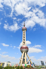 Obraz premium Shanghai Oriental pearl TV tower under the blue sky.