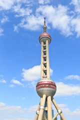 Naklejka premium Shanghai Oriental pearl TV tower under the blue sky.