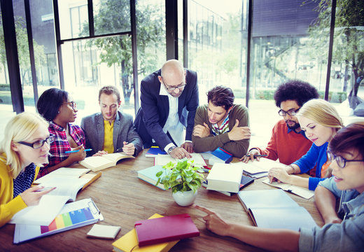 Diverse Students Studying With Their Professor