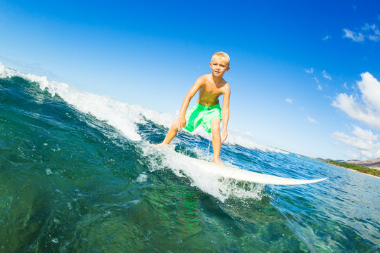 Boy Surfing Ocean Wave