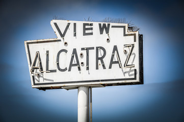 broken old and abandoned sea-side neon sign reads View Alcatraz